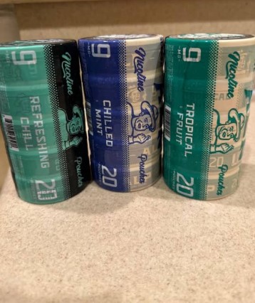 This is a photo of Alp Nicotine pouches chilled mint flavor 6mg, mountain wintergreen flavor 6mg and tropical fruit flavor 6mg in packs of 5 tins each containing 20 nicotine pouches